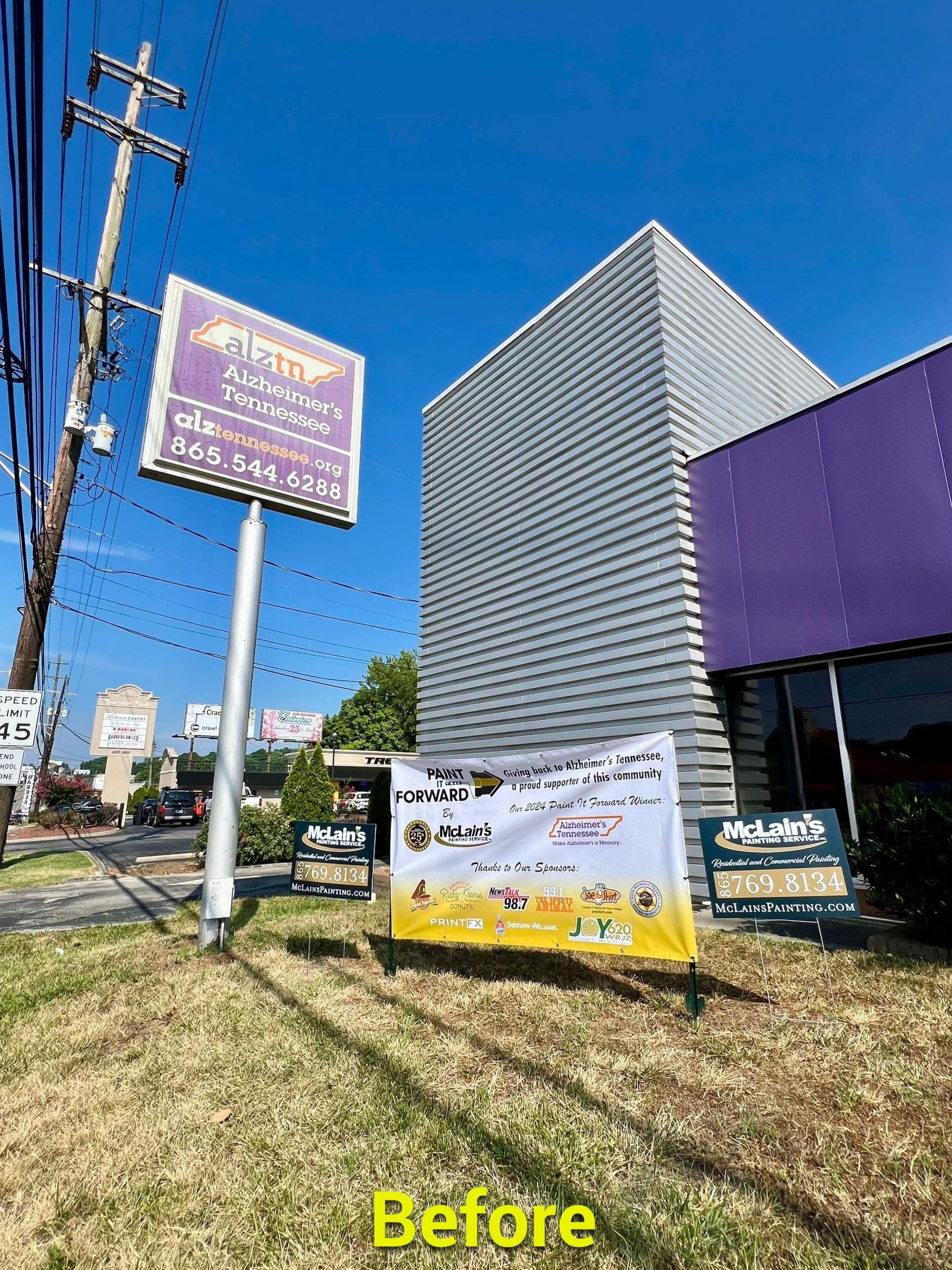 A before picture of a sign in front of a building.