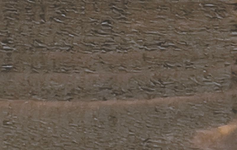A close up of a piece of wood with a grainy texture.