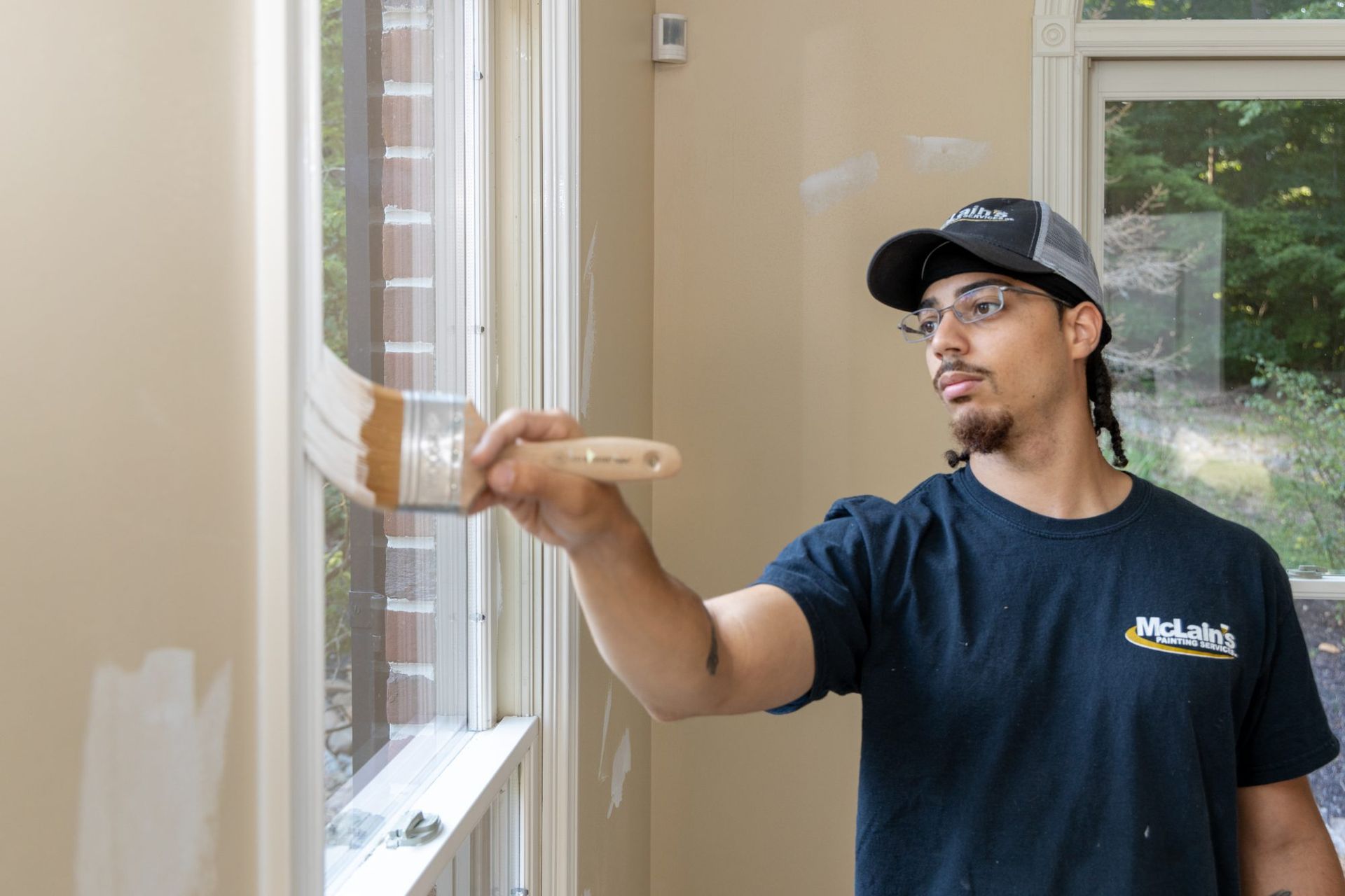 Mclains painting employee painting trim