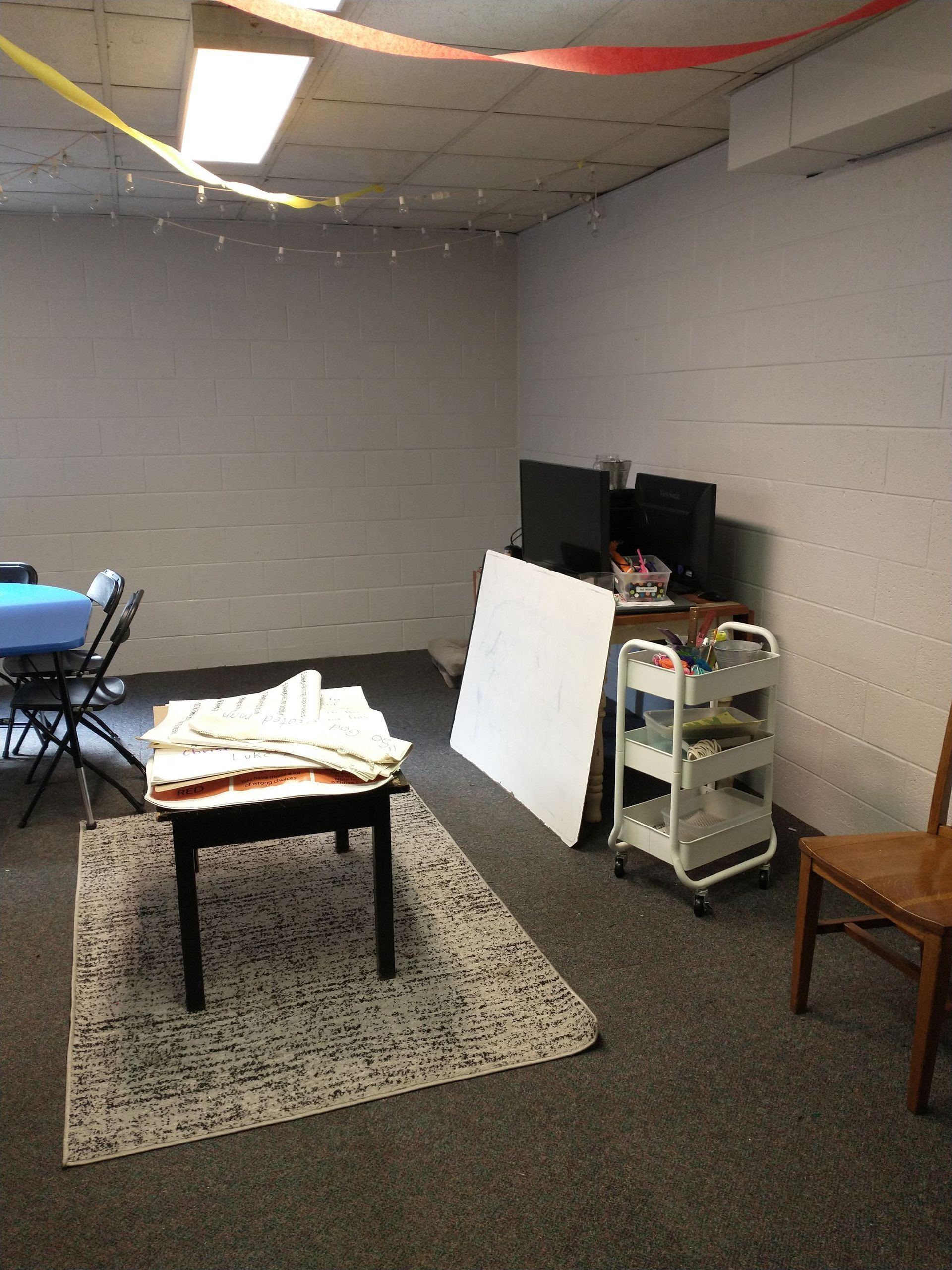 A room with a table and chairs in it