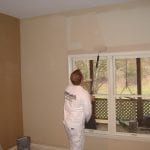 James Travis rolling a wall