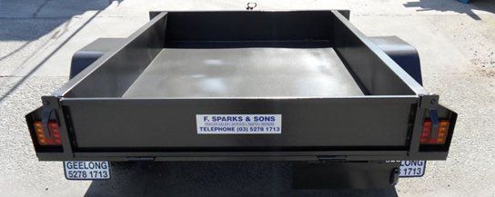 A Black Trailer Is Parked On The Side Of The Road – North Geelong, VIC - F Sparks & Sons