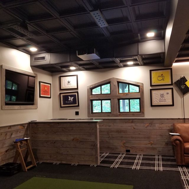 A room with a lot of pictures on the walls