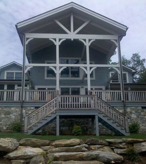 A large house with stairs leading up to it