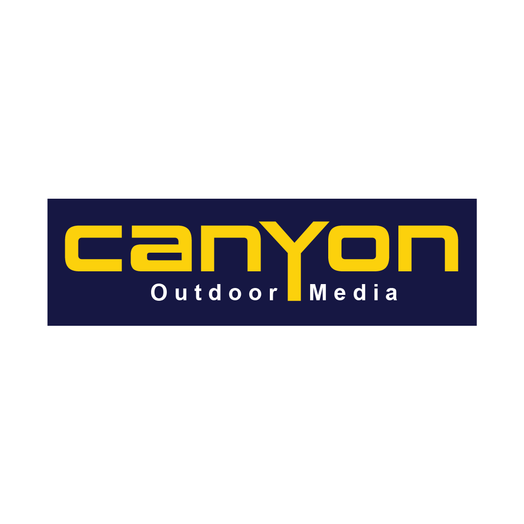 The canyon outdoor media logo is blue and yellow on a white background.