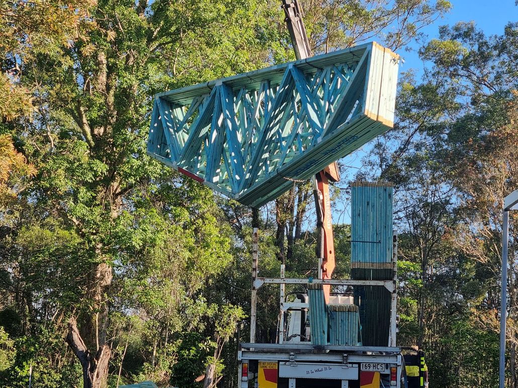 Crane lifting timber trusses Crane lifting timber trusses