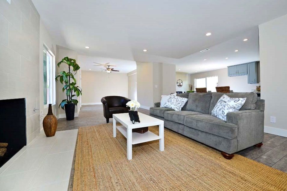 Bright living room with large windows and natural light.