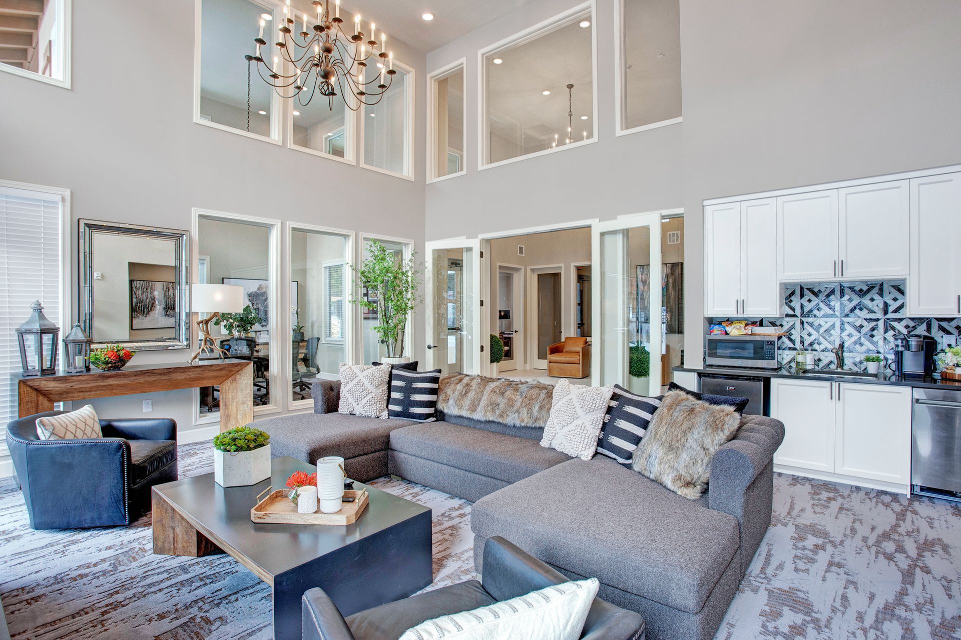 A living room filled with furniture and a chandelier.