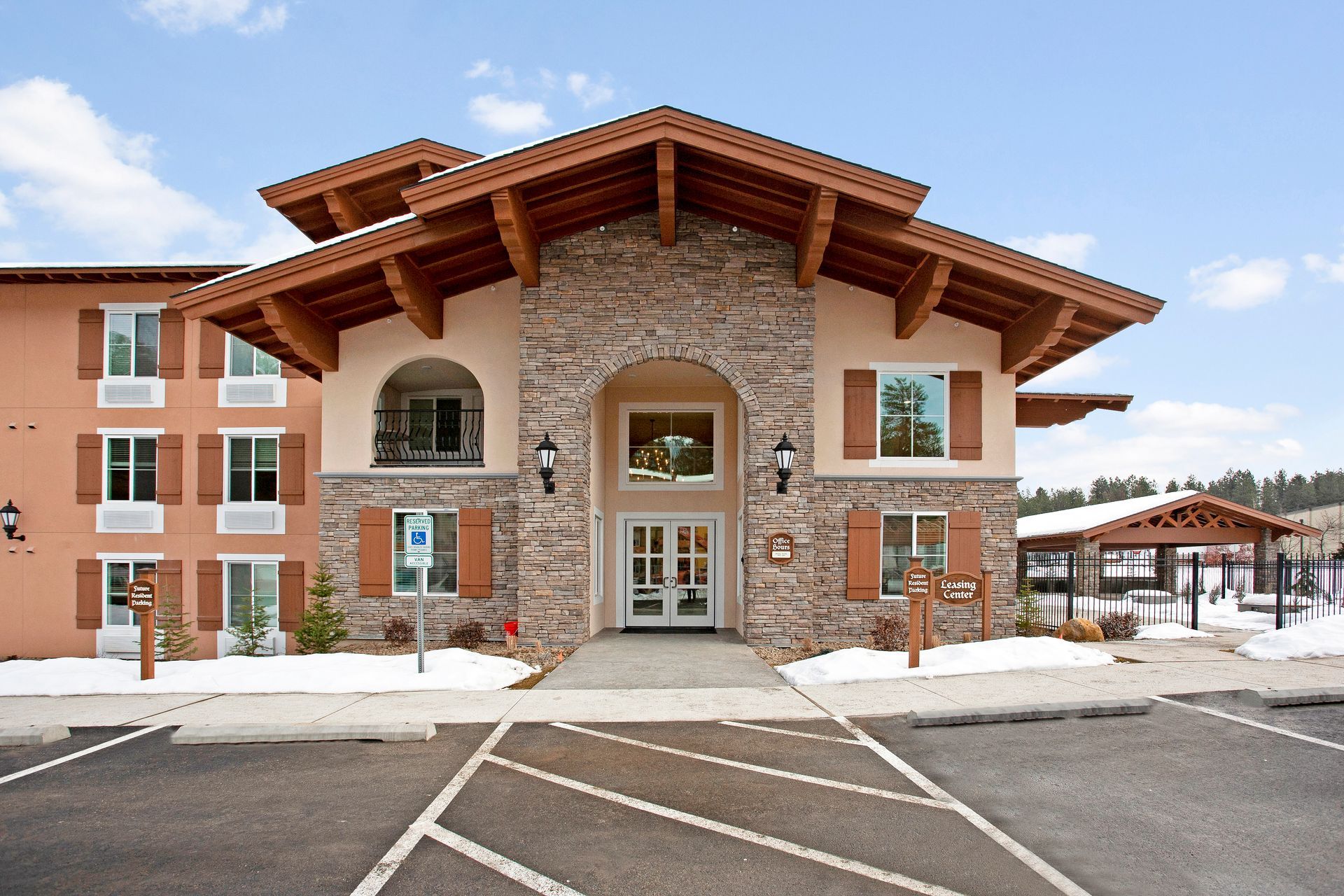 A large building with a handicapped parking spot in front of it