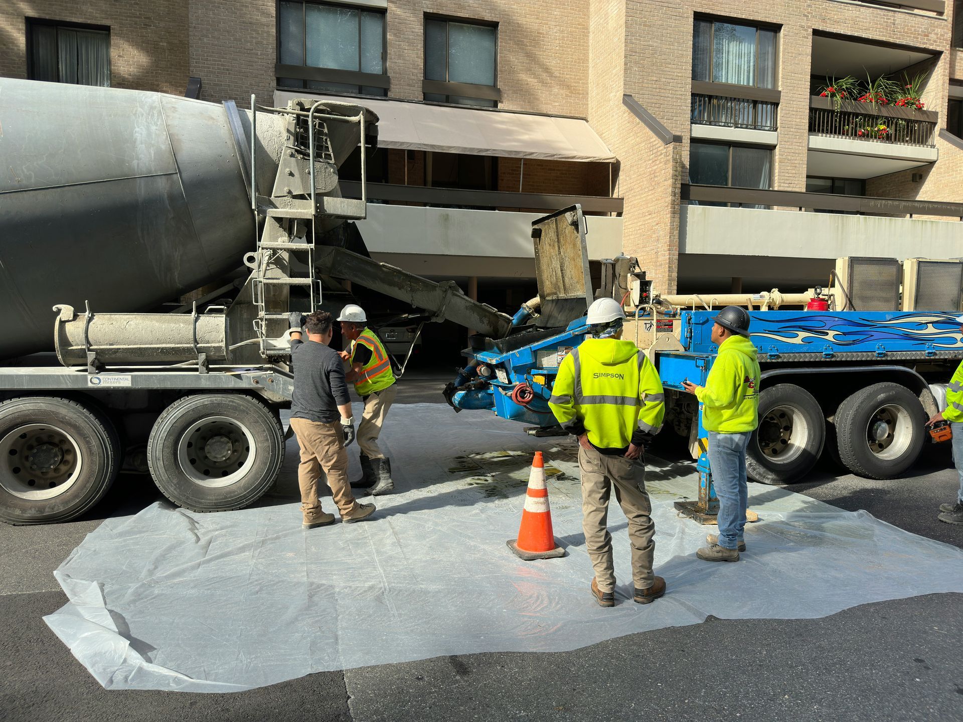 Crew pouring fresh concrete with mixer truck by Concrete Services in Renton WA on a commercial project.