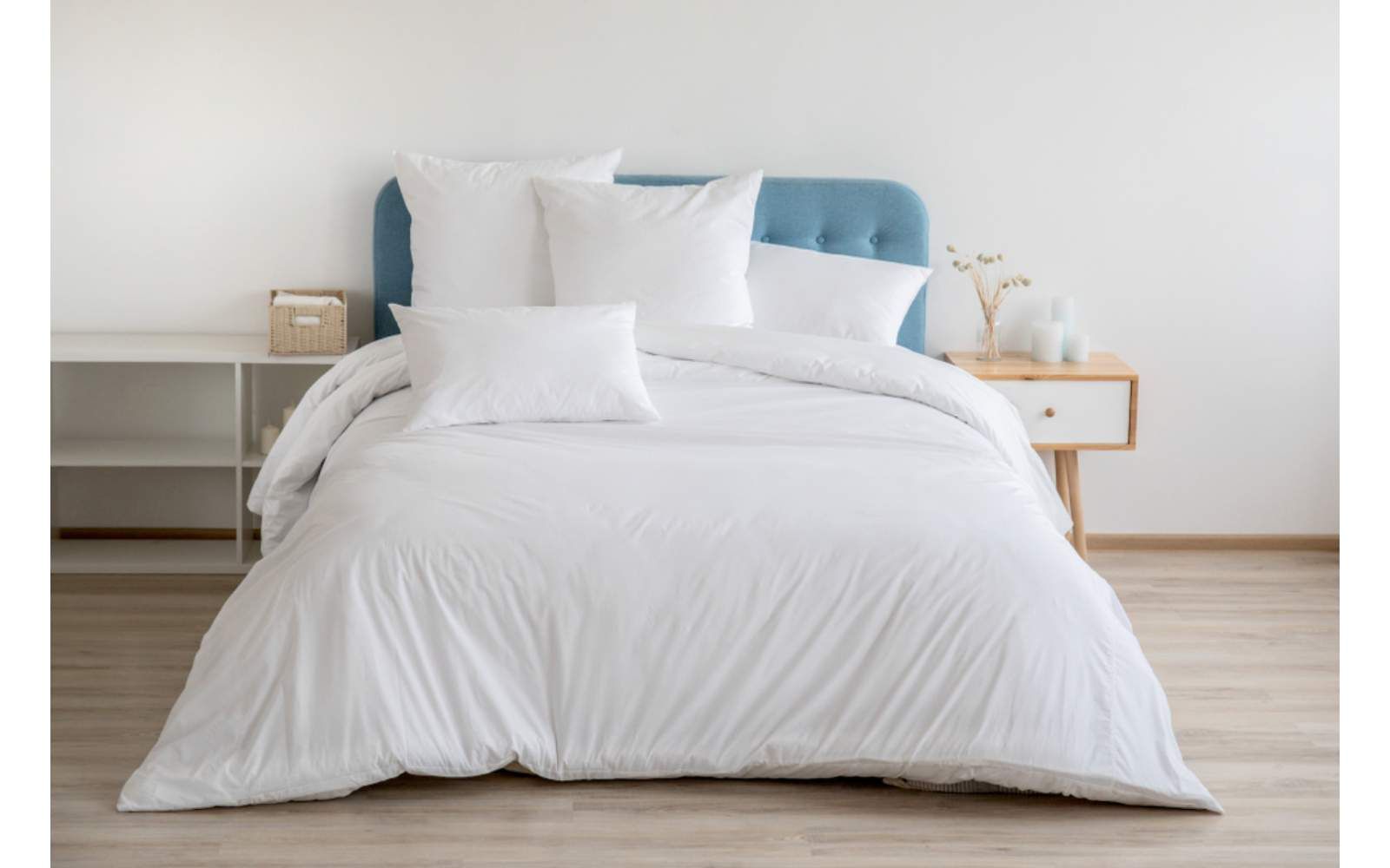 A Bed With A White Comforter And Pillows On It — Macquarie Dry Cleaners In Dubbo, NSW