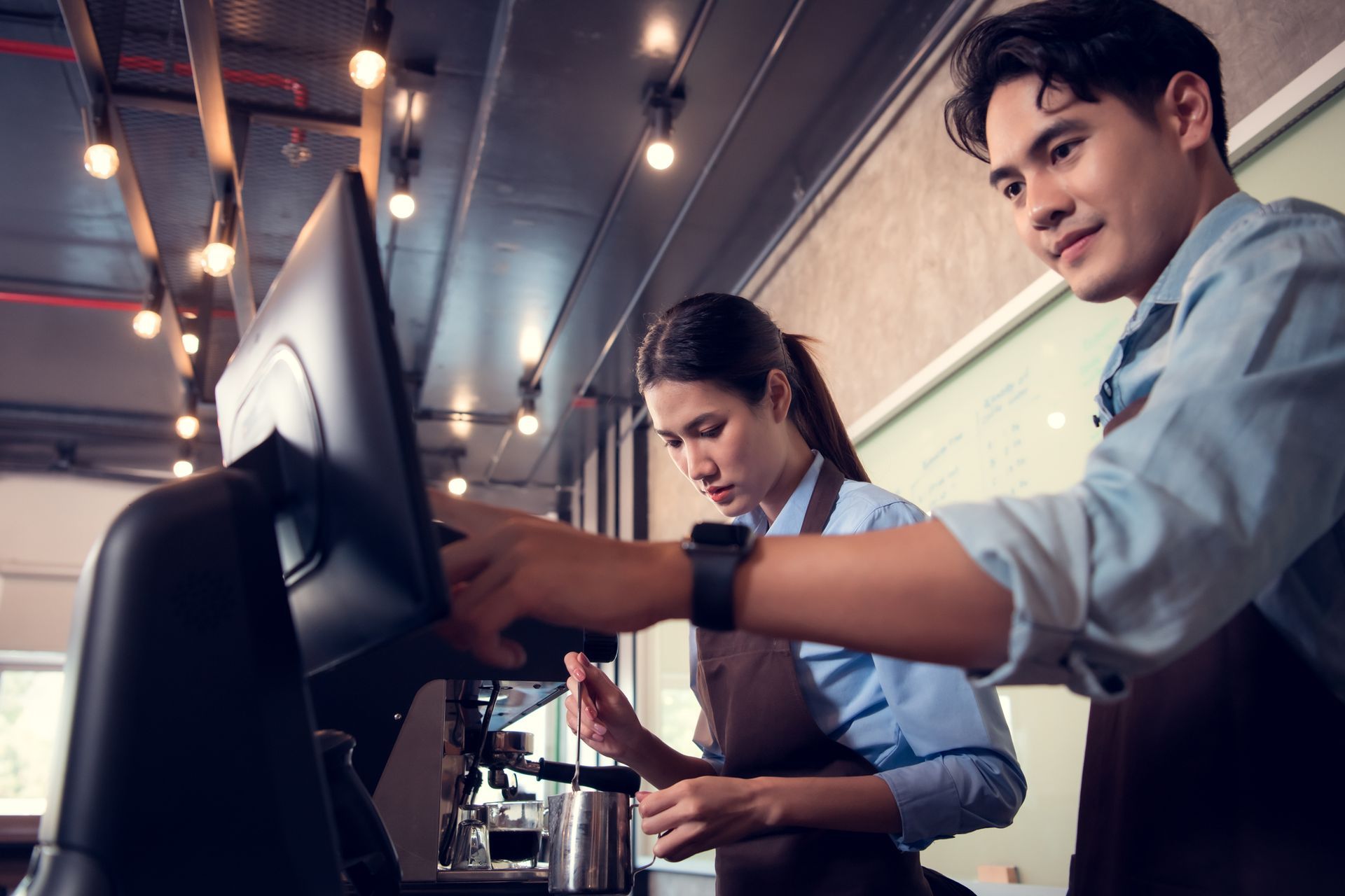 retail employees operating POS system