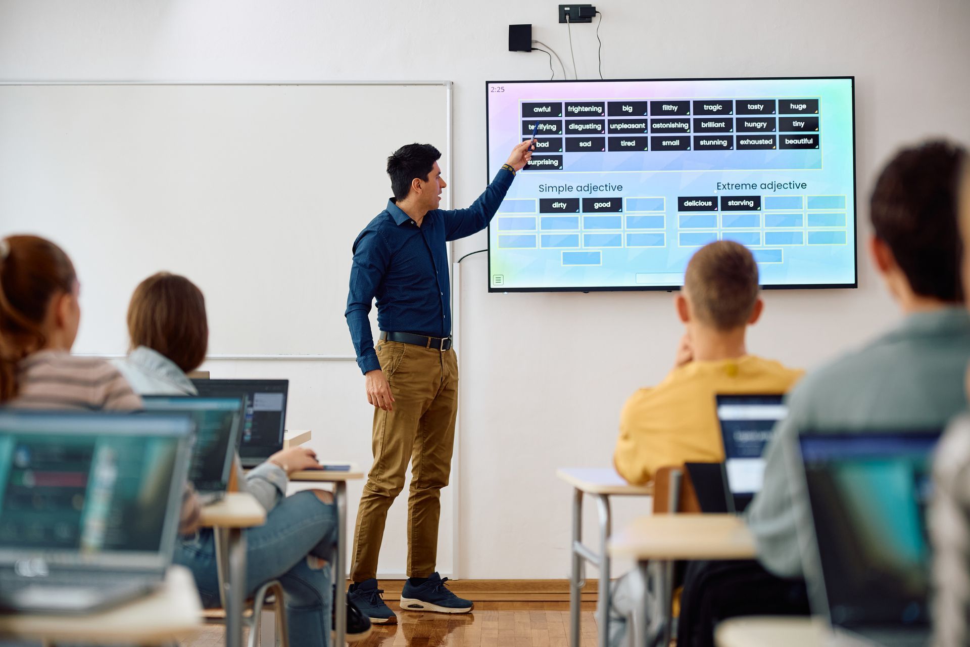 in class presentation on a tv screen during new IT training