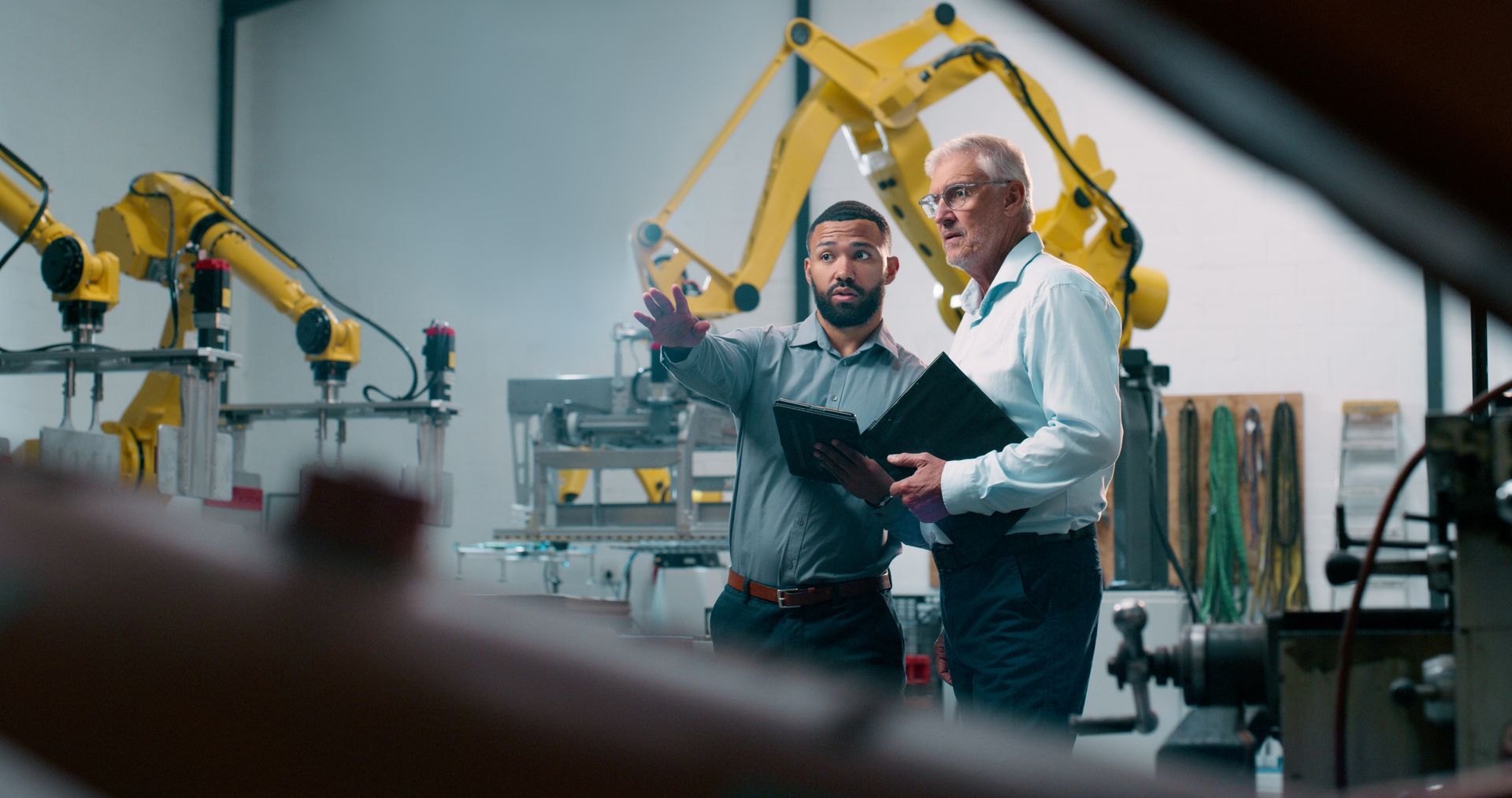 IT professional demonstrates automation in a manufacturing facility