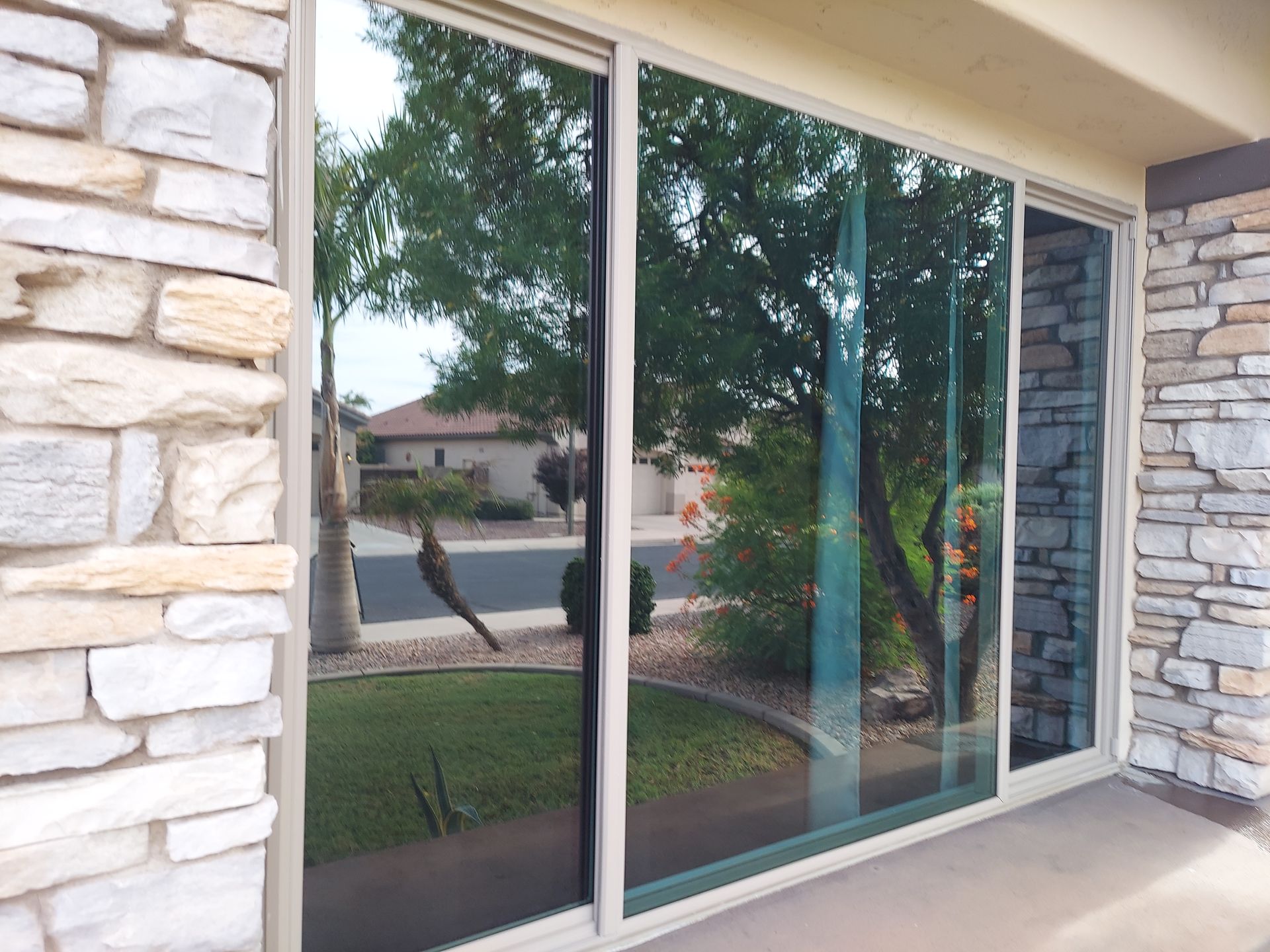 Spacious residential window with a crystal-clear view, allowing ample natural light to illuminate the interior.