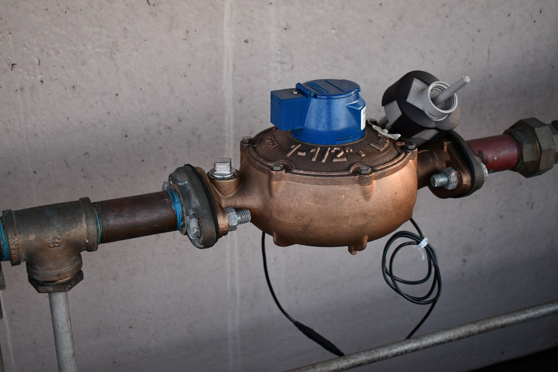 A water meter with the number 7-112 on it