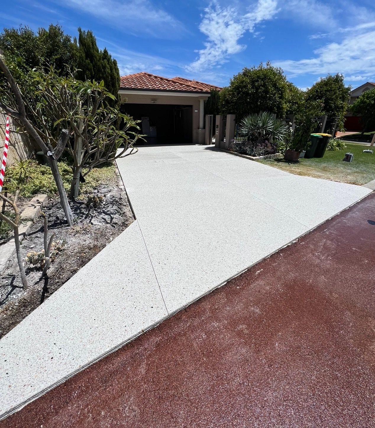Exposed concrete driveway for Manudurah home