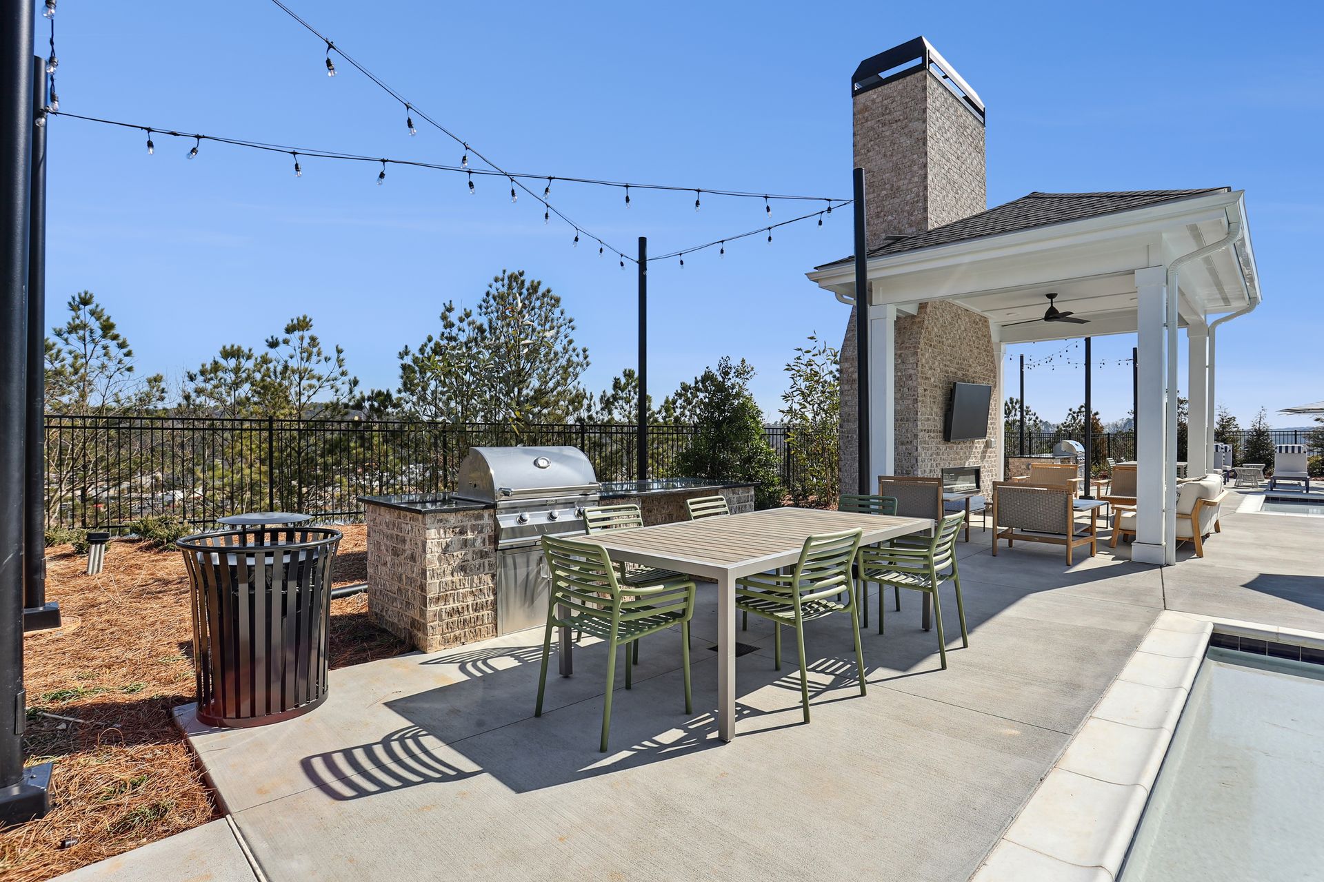 Upland at Emerson poolside grilling area with hammocks and games - Cartersville, GA
