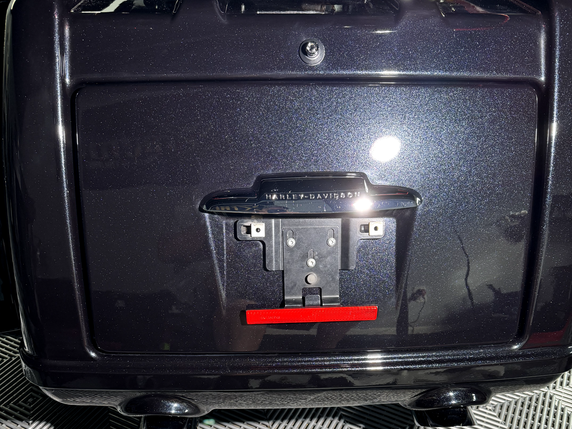 a black car with a license plate that says ' chevrolet ' on it