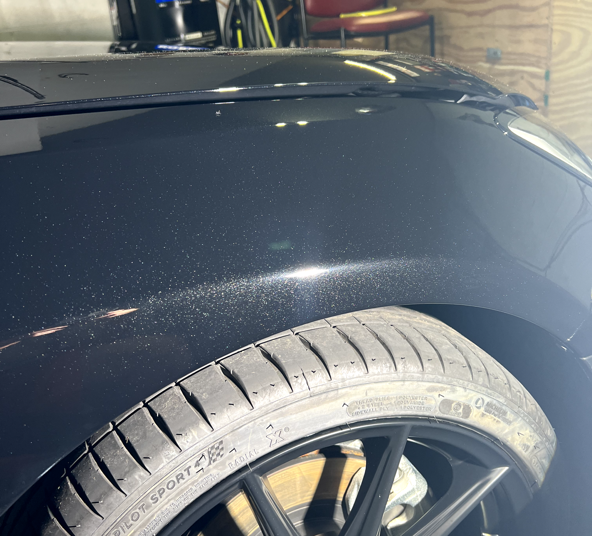 a close up of a tire on a black car