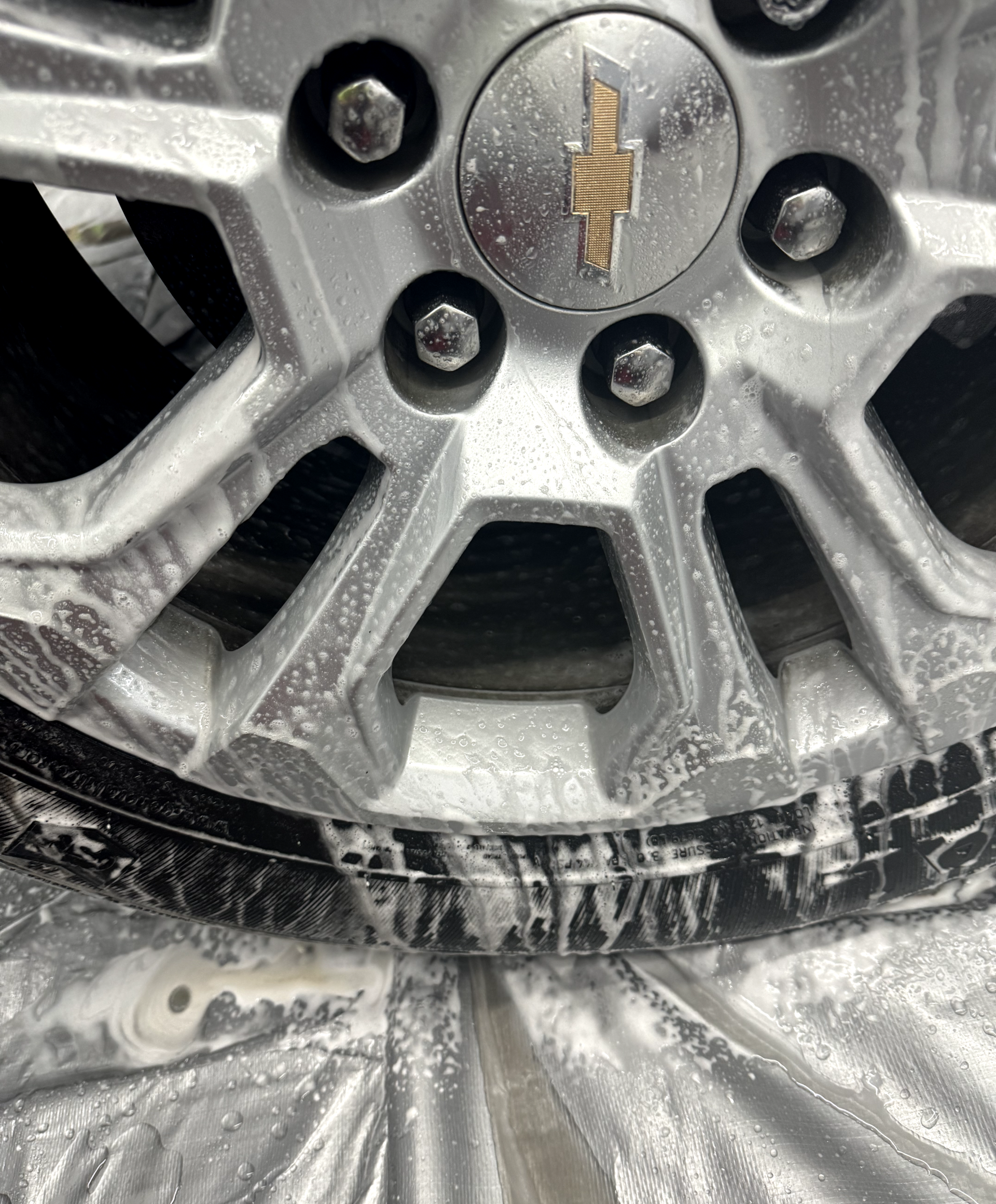 a close up of a car wheel with a tire on it .