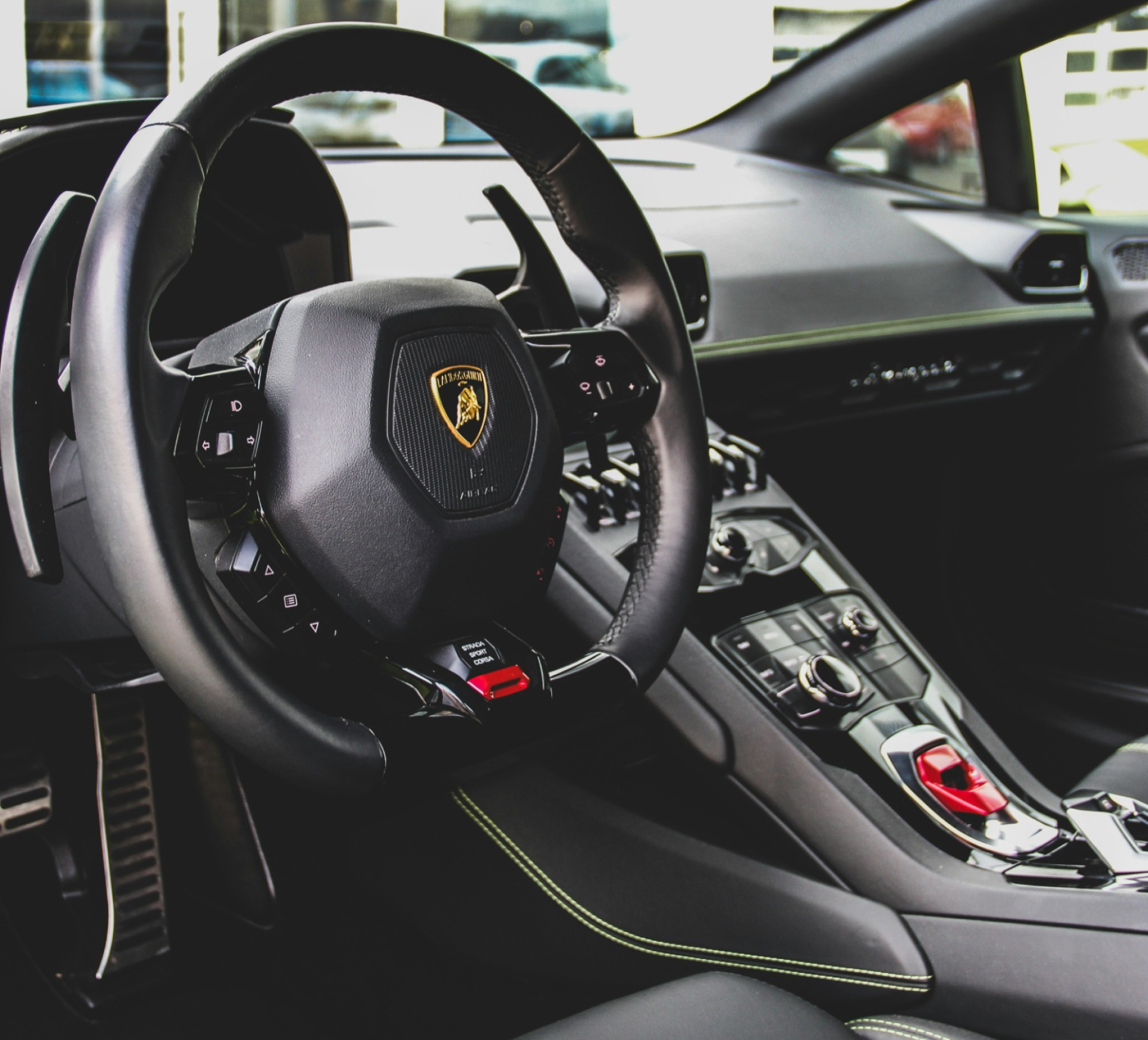 a close up of the steering wheel of a lamborghini