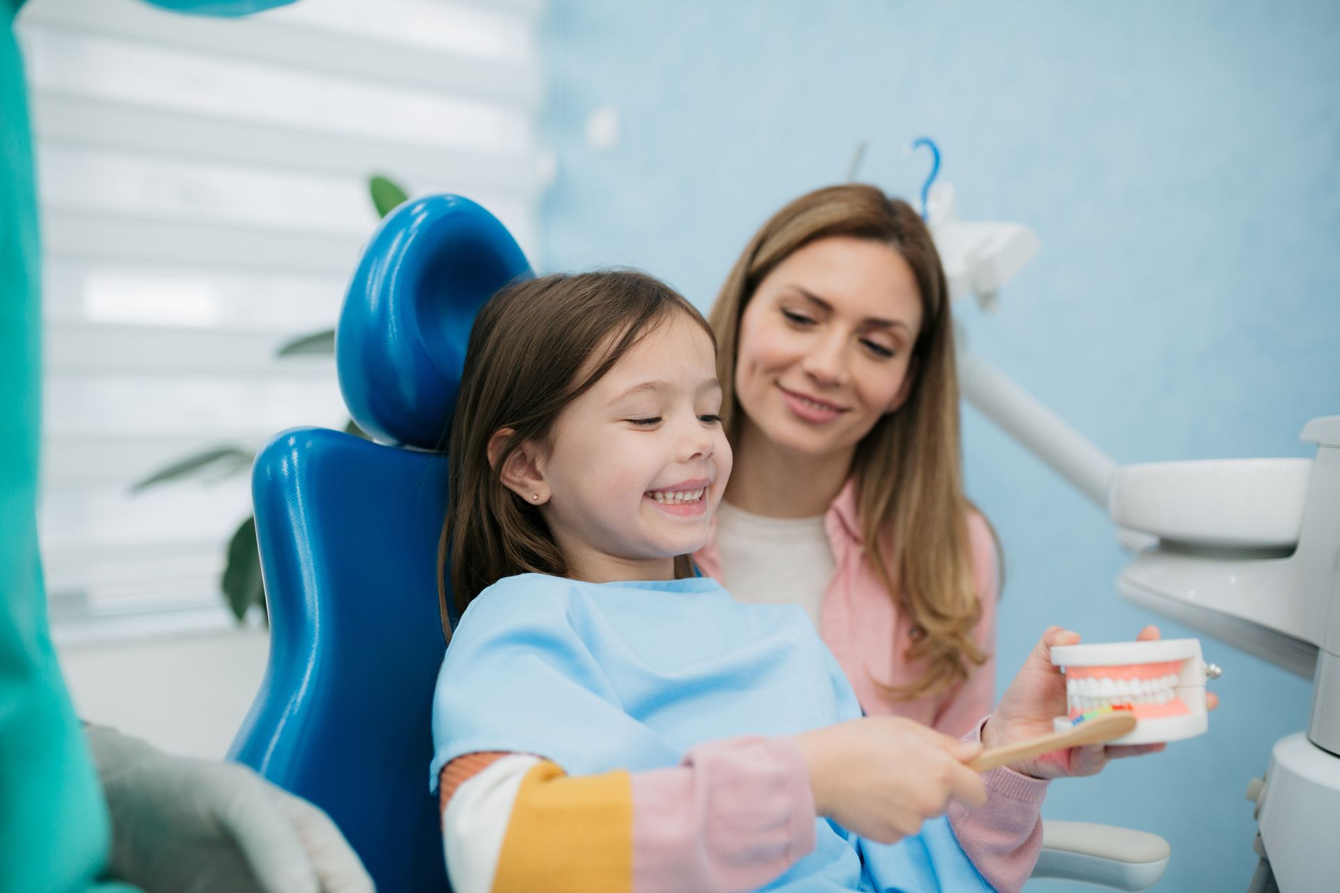 Little girl visiting a dentist