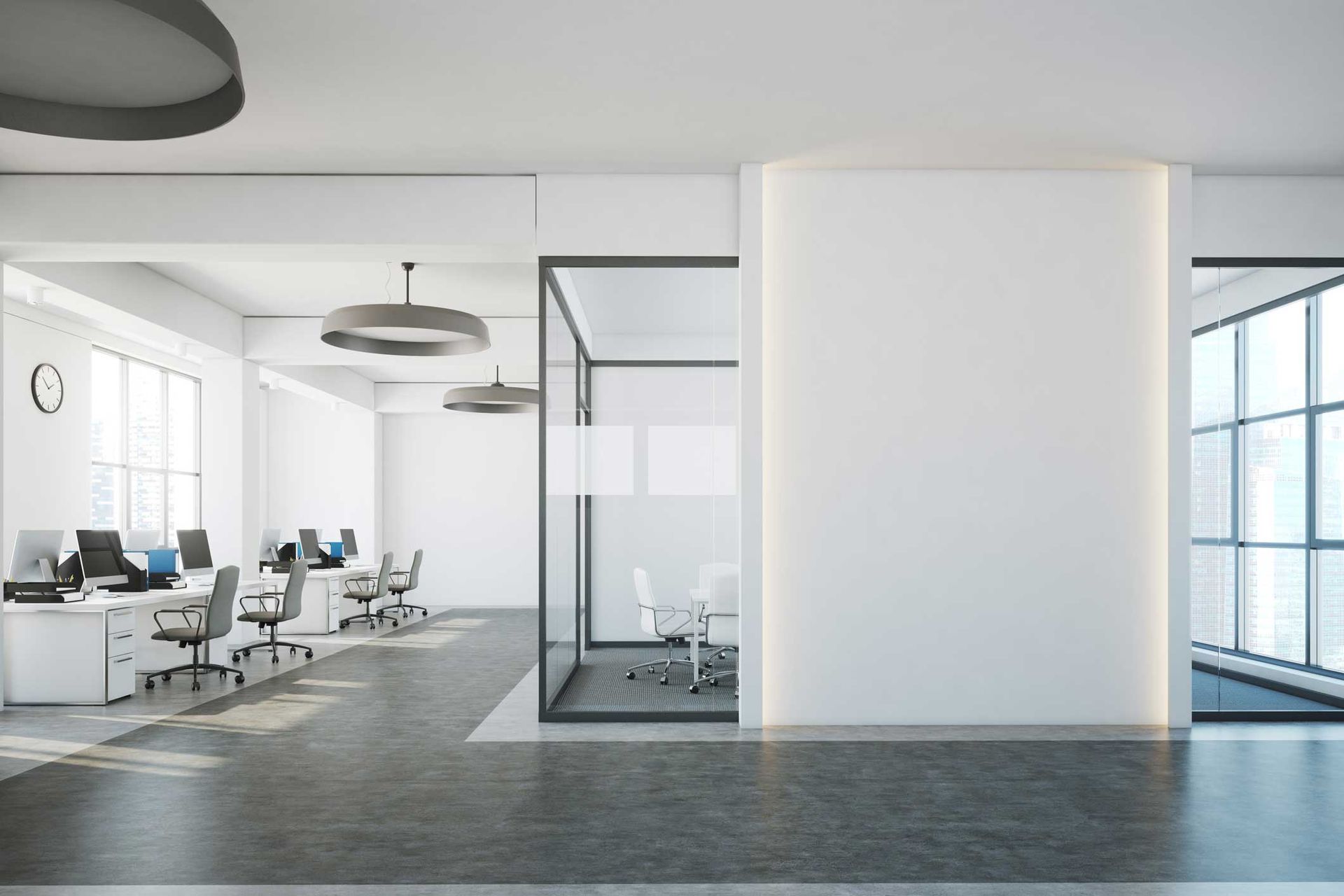 Modern open-plan office interior with desks, chairs, glass walls, and large windows