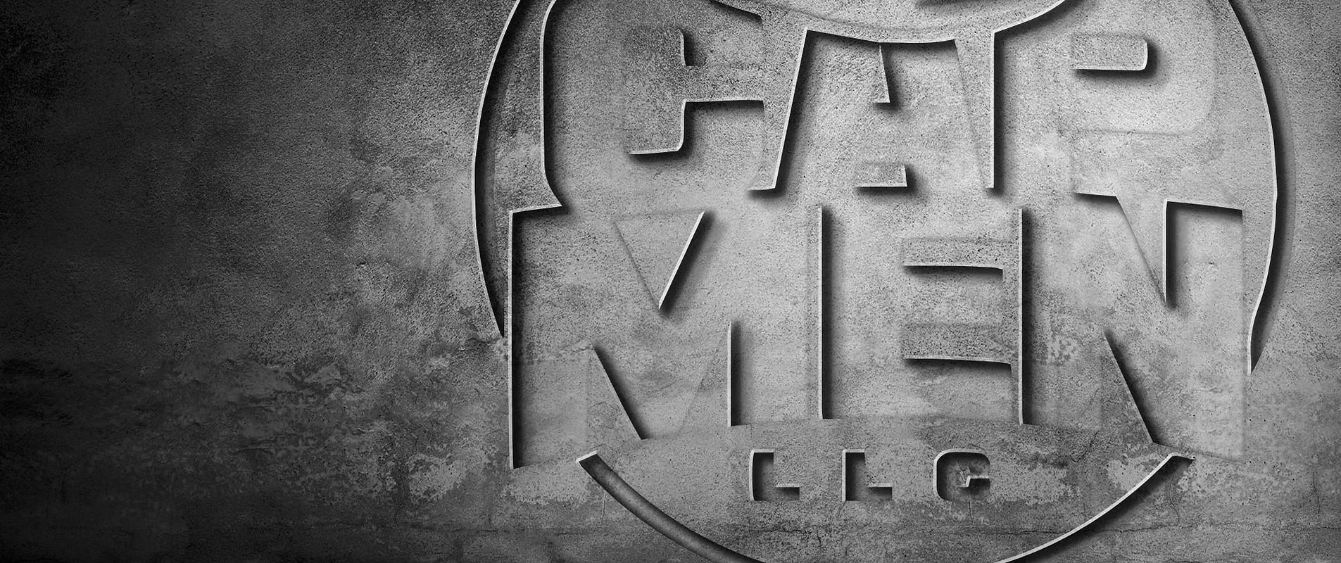 Gray embossed logo on textured background with stylized letters and a circular emblem