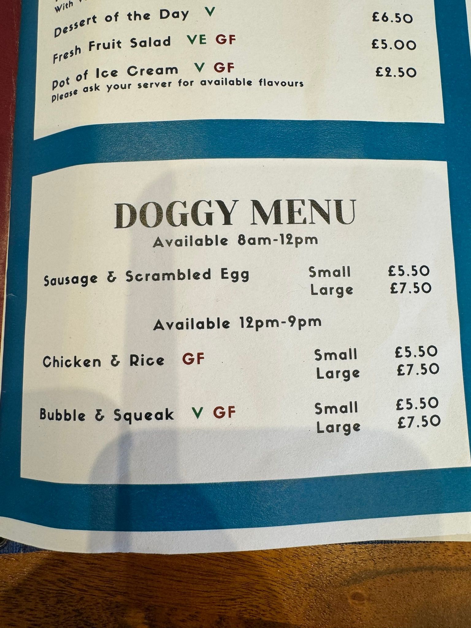 the menu with has Doggy menu in black with a teal border round the edge. 