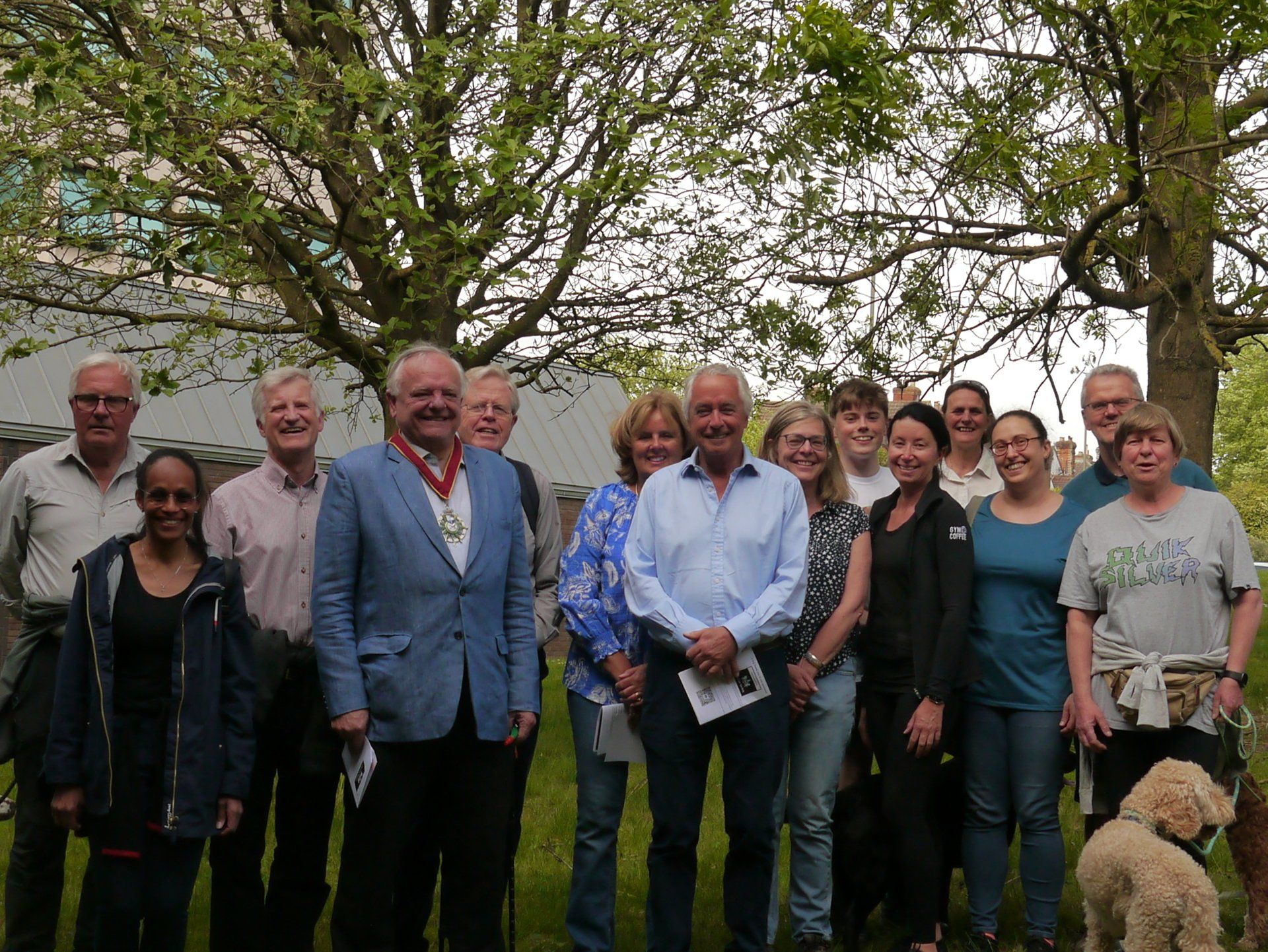 Judges from Guildford Court and High Sherrif of Surrey Chrisopher Critchlow under a tree.