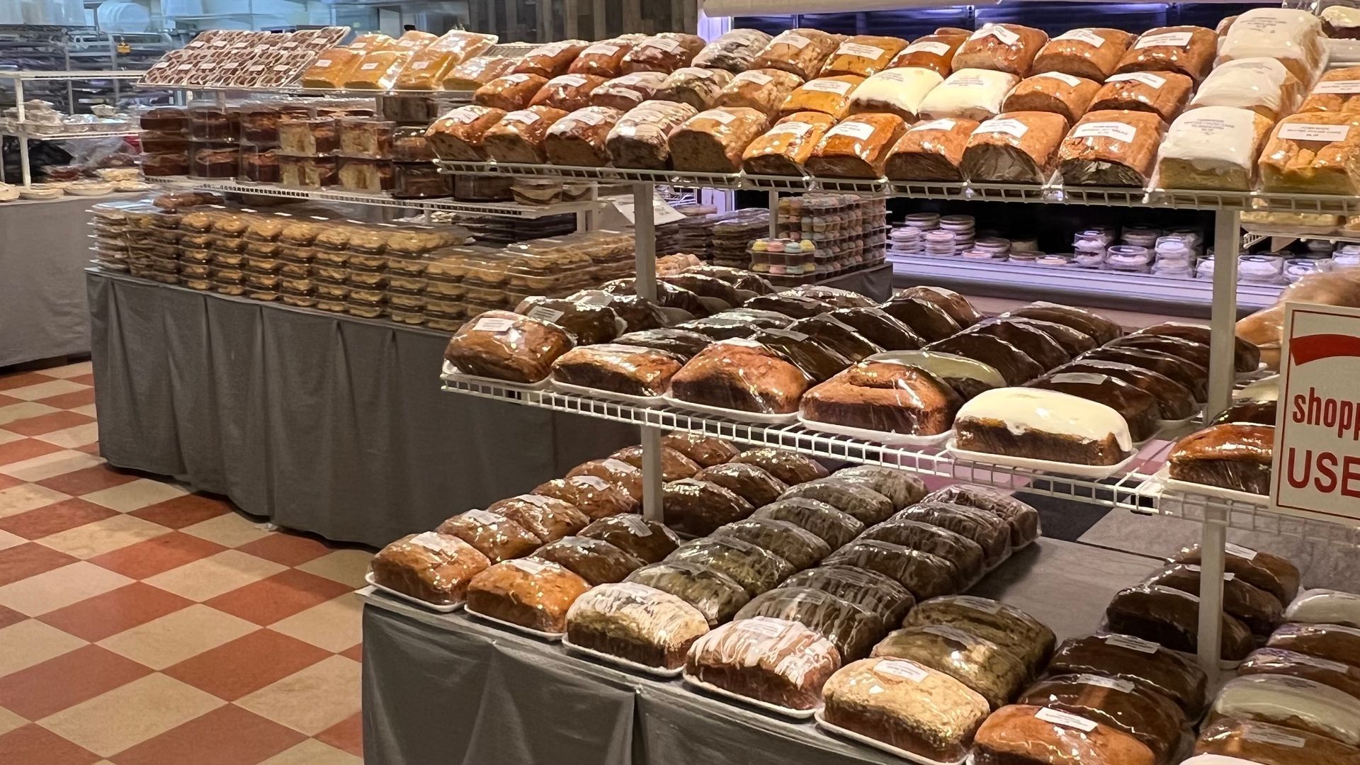 A bakery filled with lots of different types of bread.