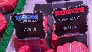 A display of rump roast and prime rump roast in a butcher shop.