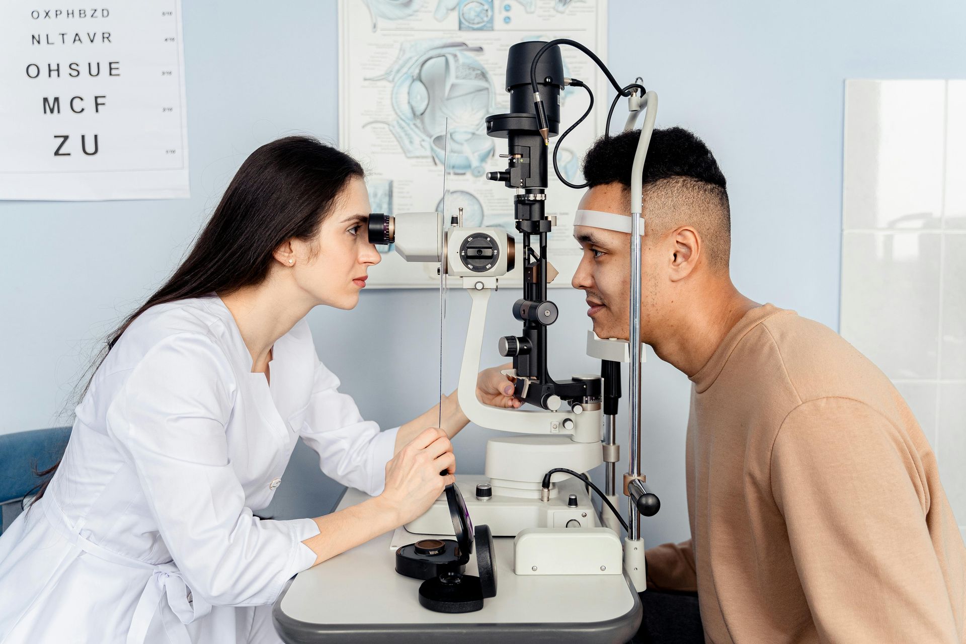 Eye exam with doctor and patient at a slit lamp in a bright clinic