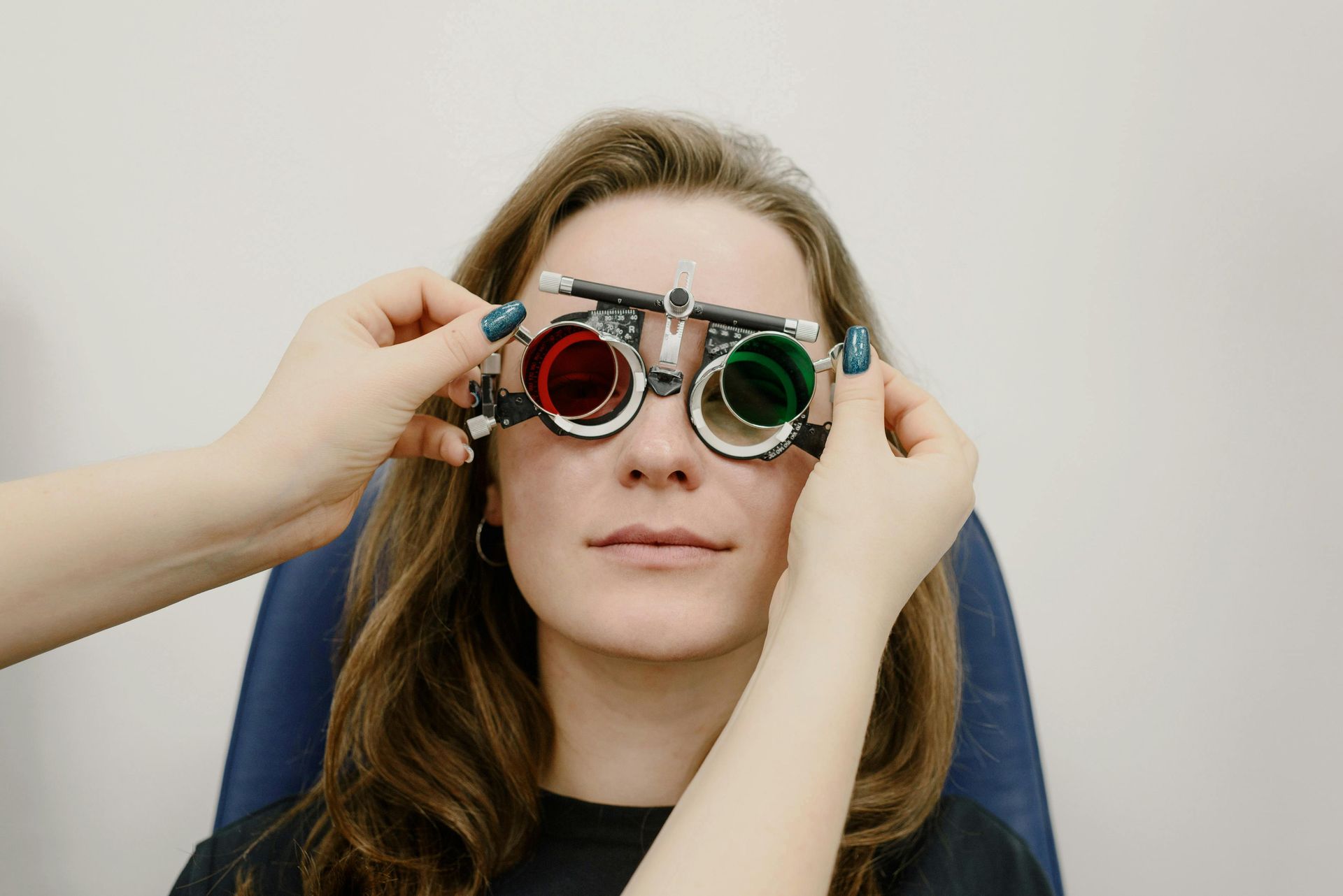Eye exam with doctor and patient at a slit lamp in a bright clinic