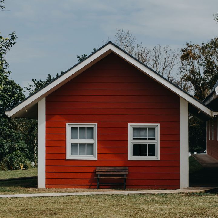 Albuquerque ADU Experts, NM attached ADU with red exterior siding and pitched roof built for extra living space.