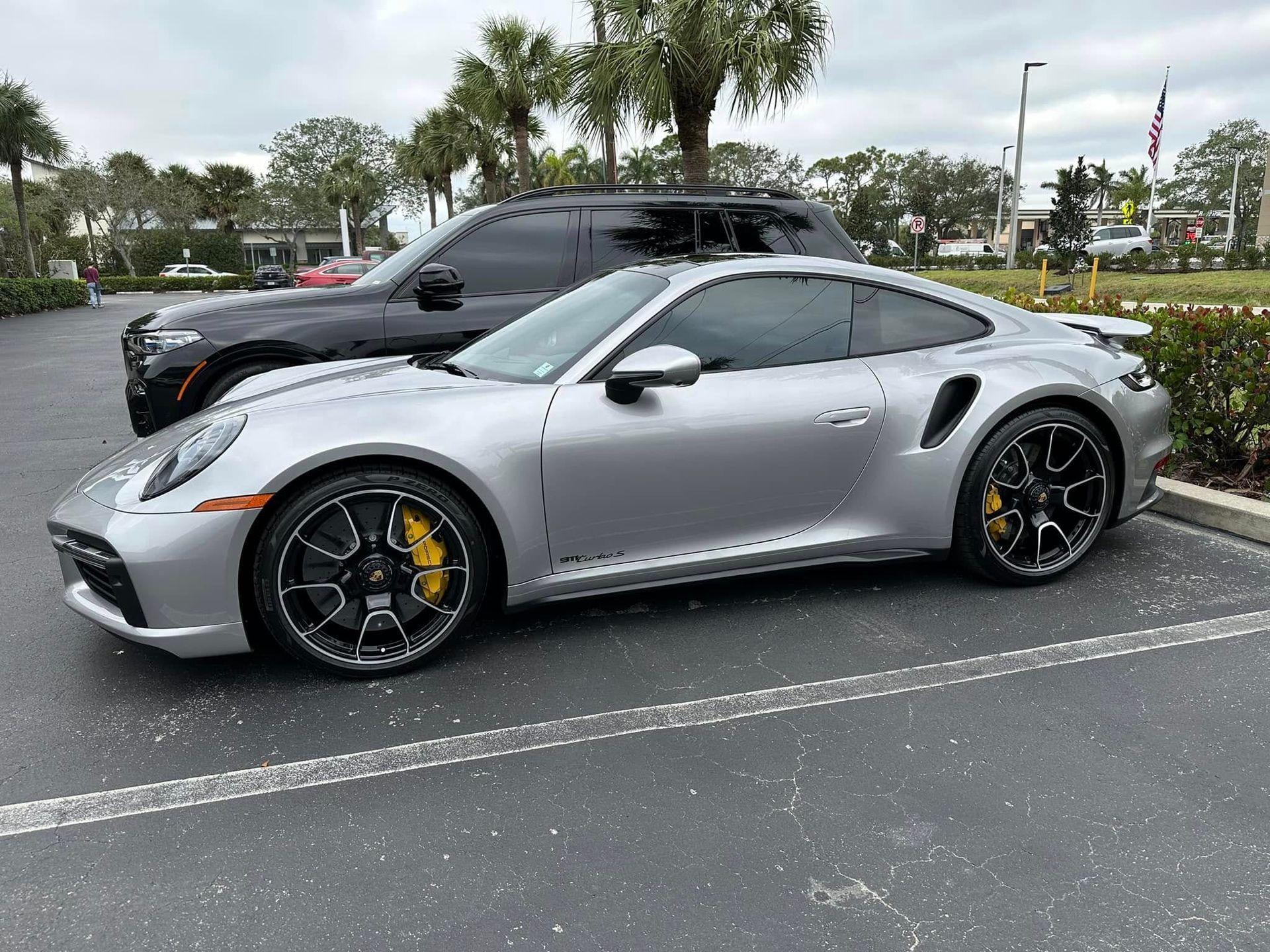 Silver Porsche coupe with tinted windows