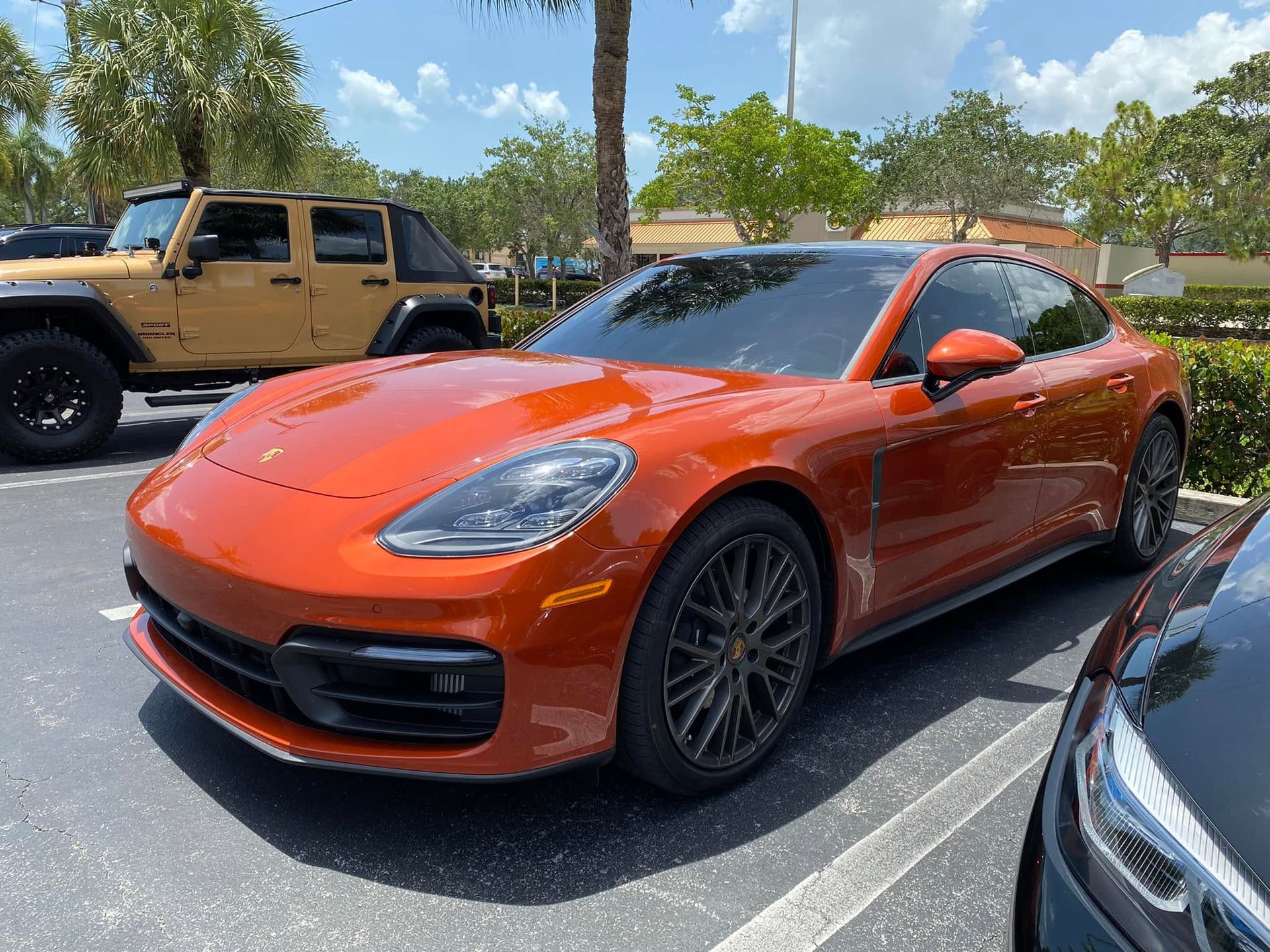 Orange Porsche with tinted windows