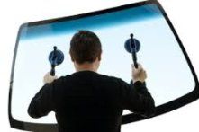 Man Holding A Windshield — Belleville, IL — Glass & More Inc. Man Holding A Windshield — Belleville, IL — Glass & More Inc.