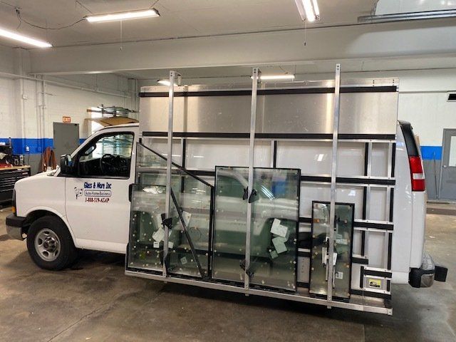 Black Color Van With A Company Banner — Belleville, IL — Glass & More Inc. Black Color Van With A Company Banner — Belleville, IL — Glass & More Inc.