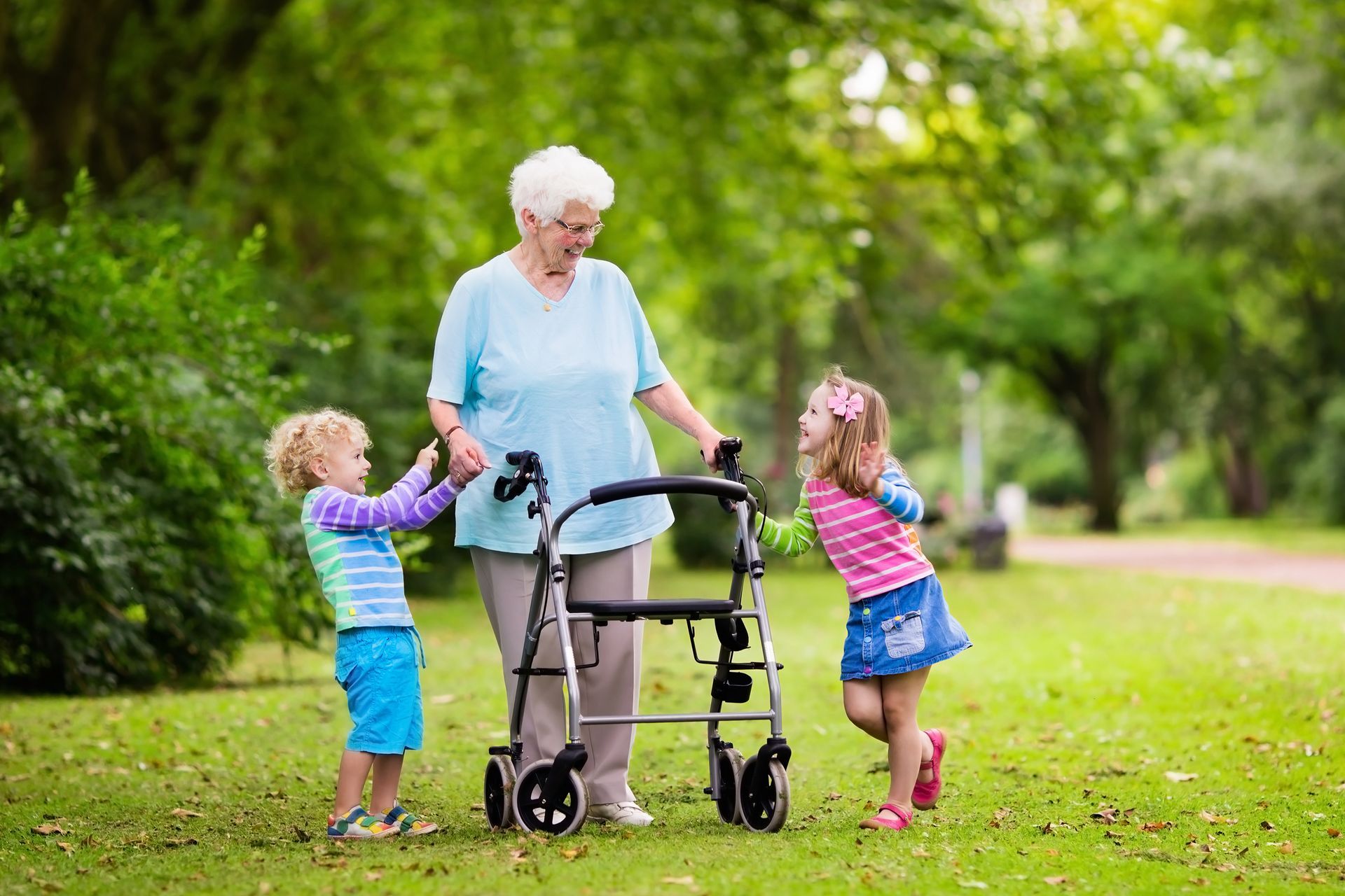 Happy Grandmother with Walker Playing with Two Kids — Seymour, TX — Seymour Medical Supply