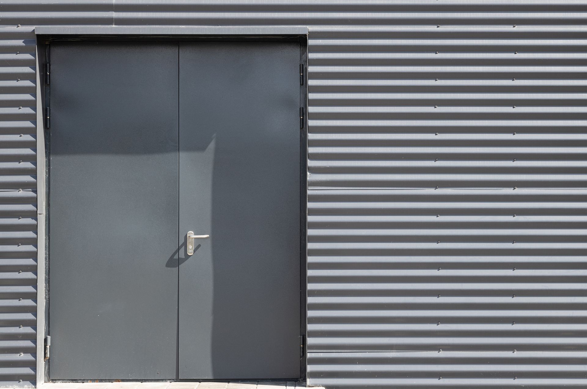 there is a door on the side of a building .