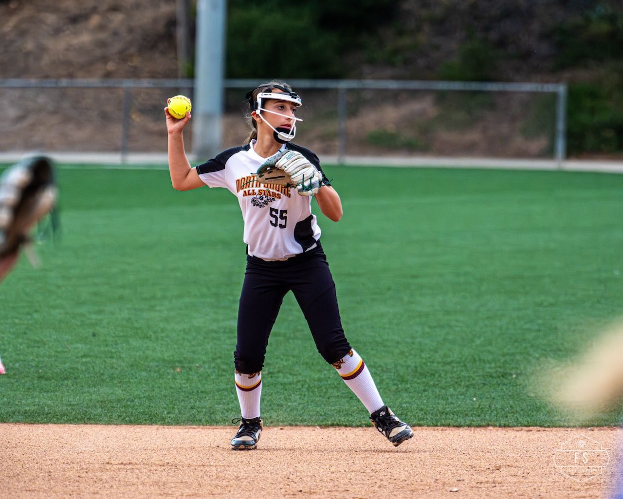 Softball player throwing a ball