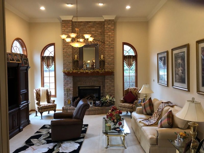 A living room with a fireplace and a couch