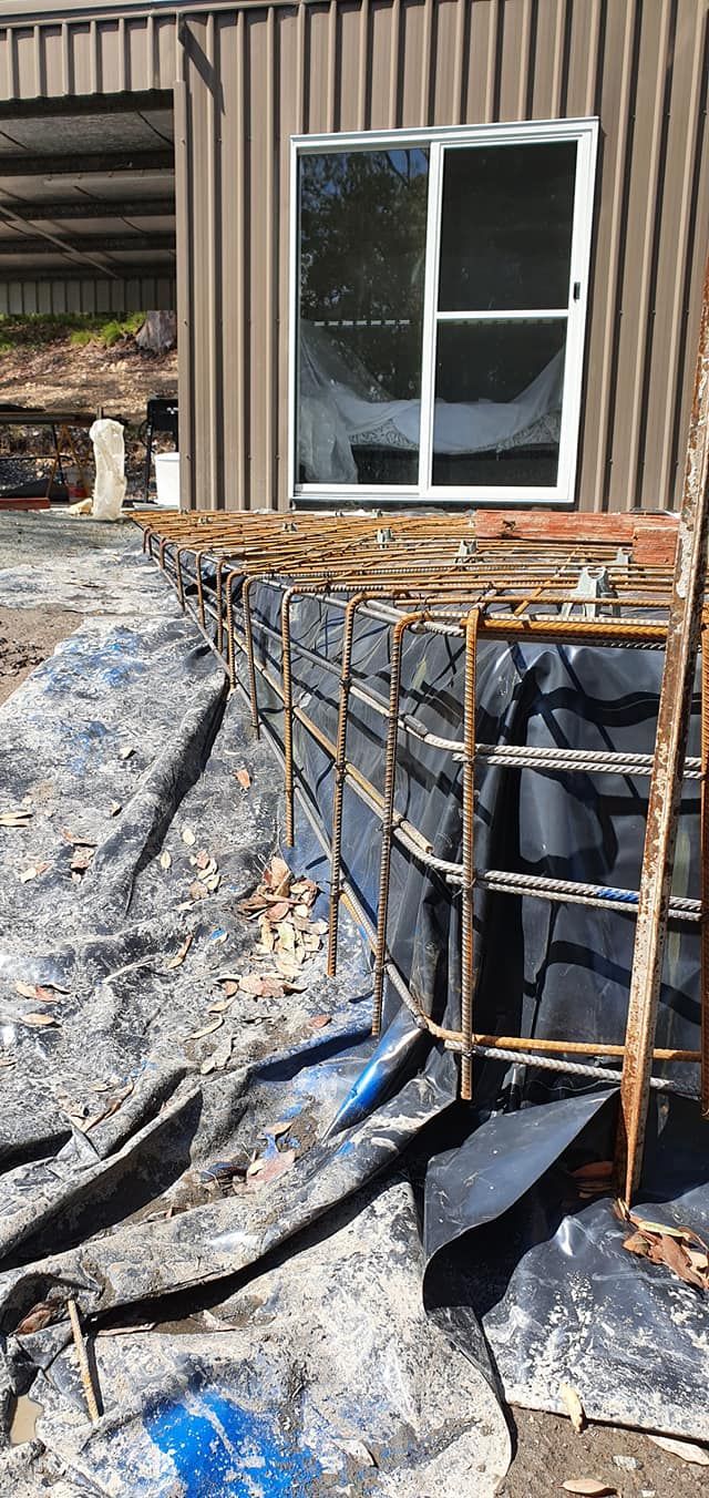 construction of a smart water drainage near a shed — MidCoast Concreting in Mount George, NSW