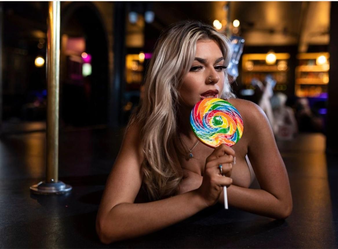 Sexy Woman Holding A Big Lollipop — After Dark Gentlemens Club In Geelong, VIC