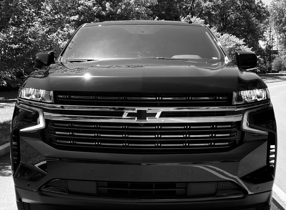 Black Chevy SUV with the front facing the camera.