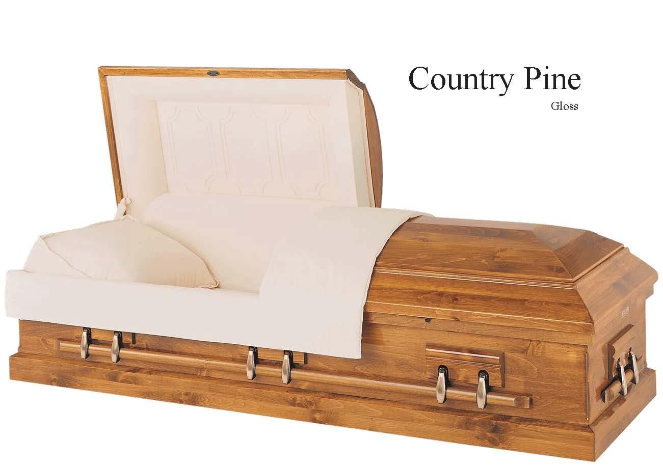 Wooden casket with beige interior, labeled Country Pine, shown open with folded fabric inside.