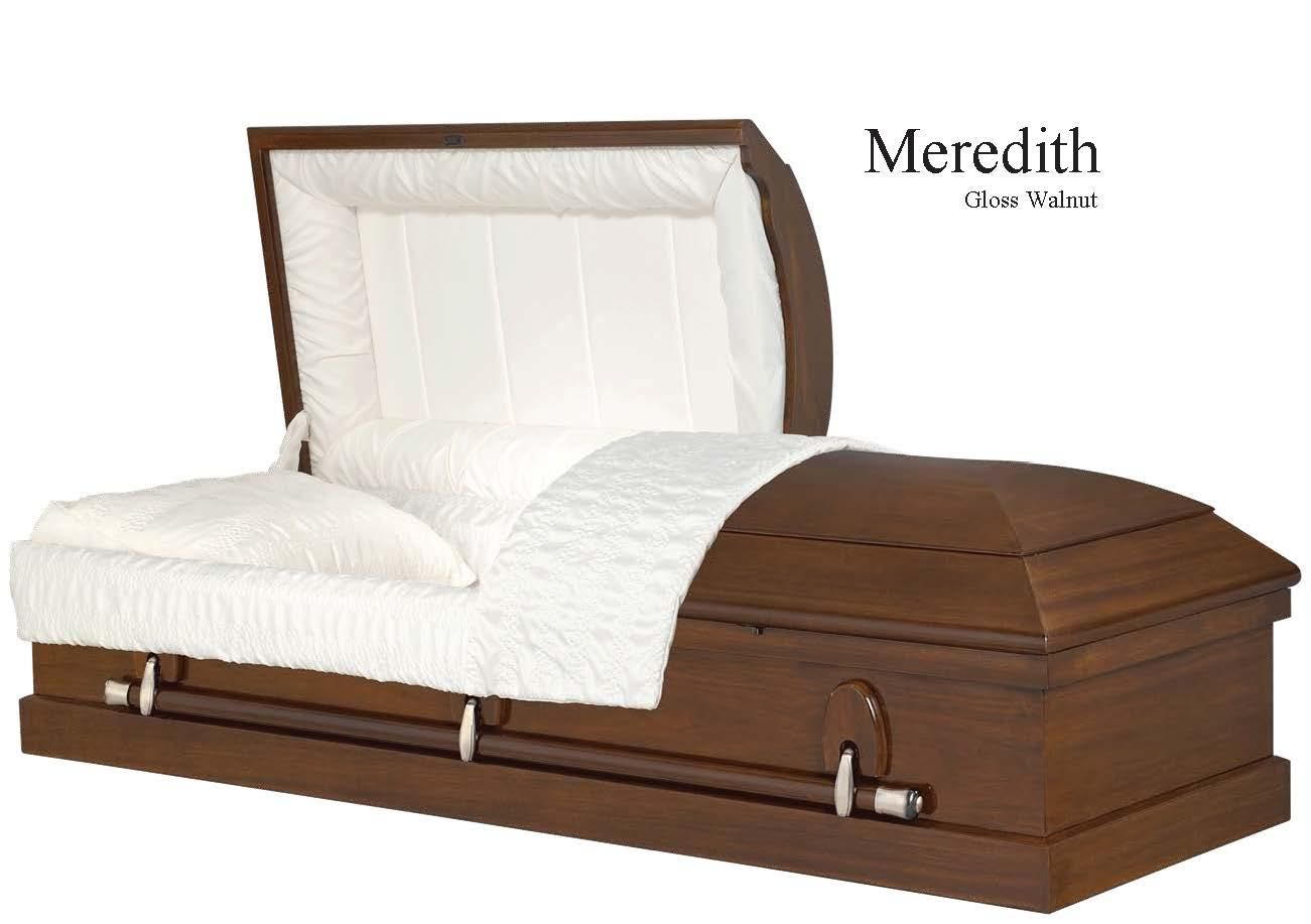 White-cushioned coffin in brown wood with the lid open, shown with the Meredith logo.