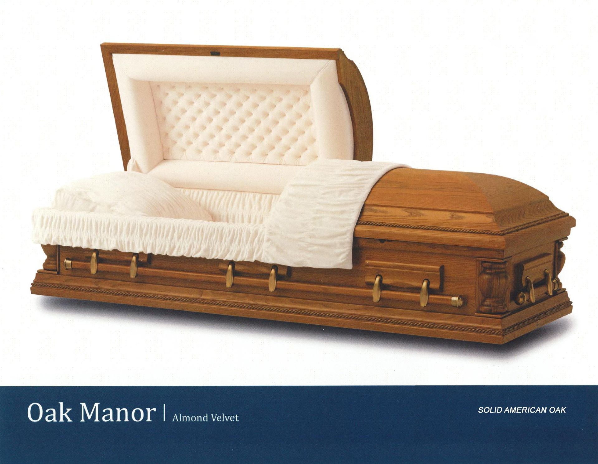Oak coffin with white satin lining and fringed cover, displayed on a plain background.